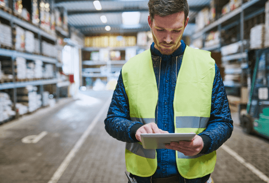 a warehouse worker holding a tablet